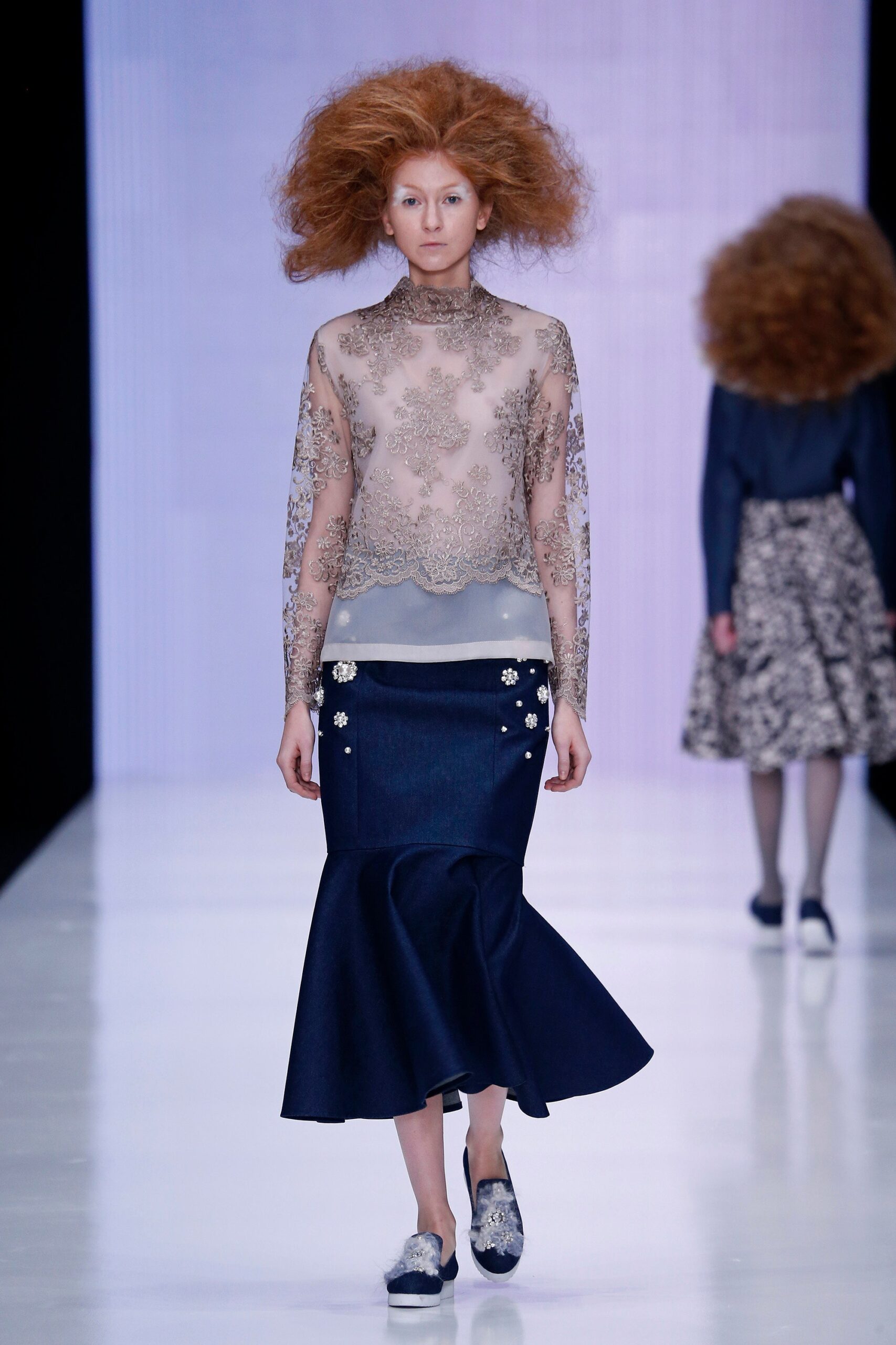 beige embroidered top with blue skirt