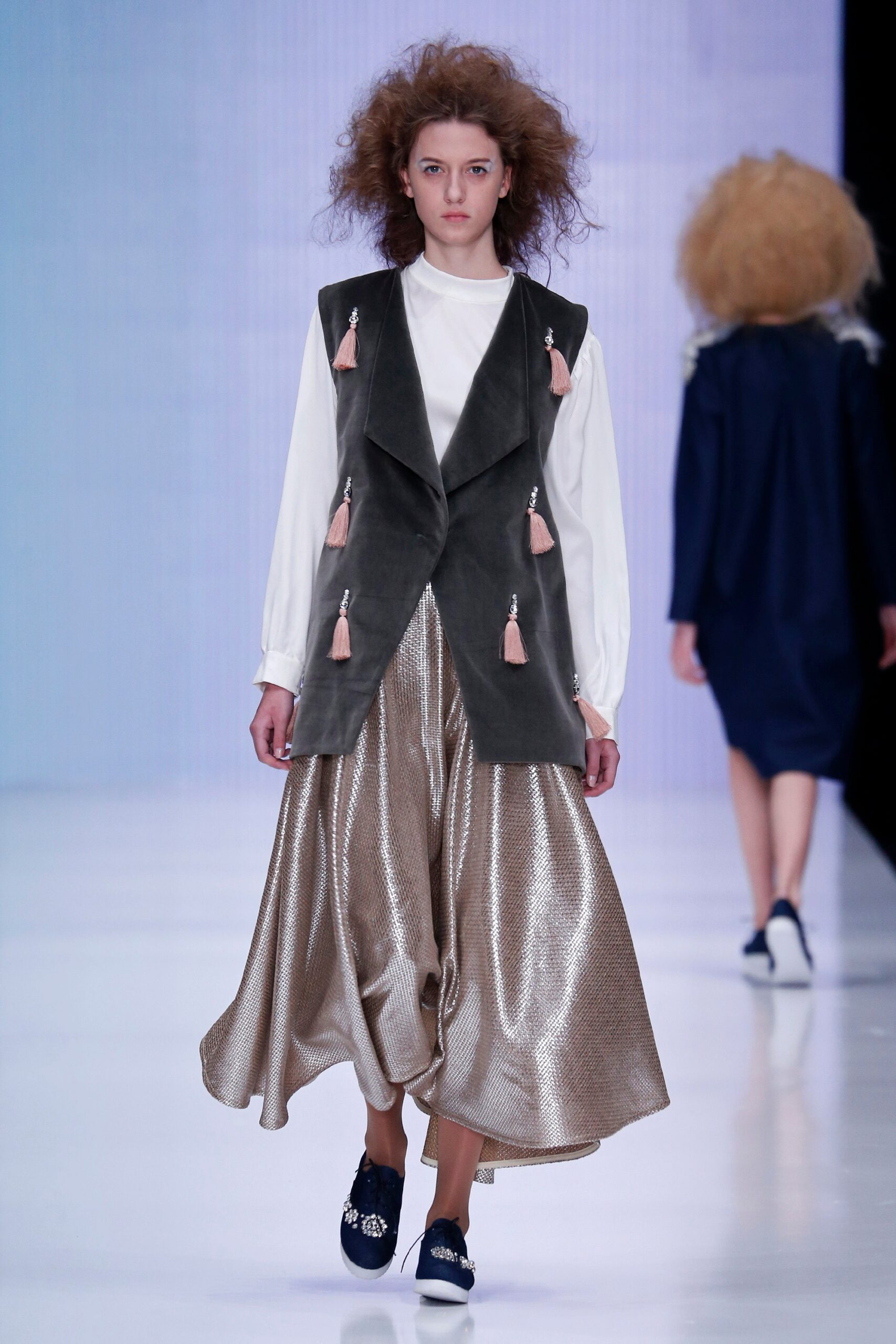 gray suede vest with white blouse