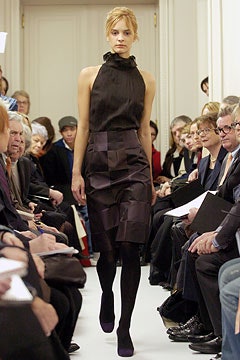 black silk sleeveless top and purple pencil skirt