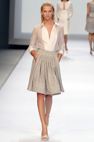 white fitted blouse and gray pleated skirt