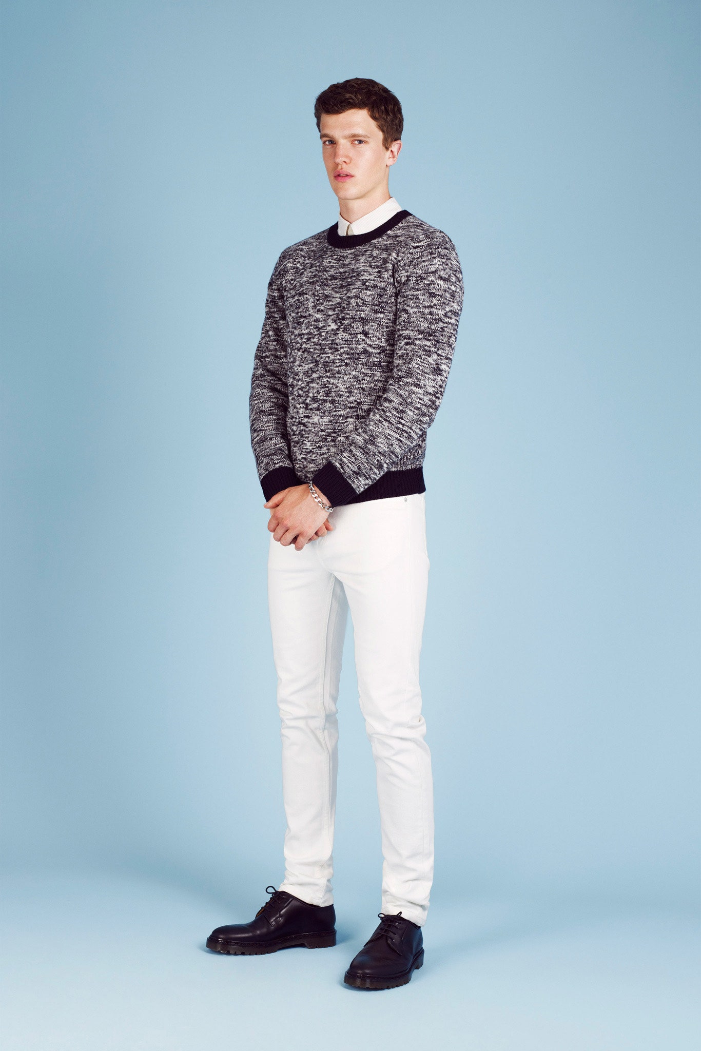 black and white textured sweater with slim pants