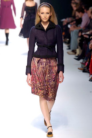purple fitted jacket with multi pleated skirt