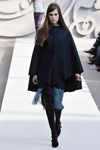 black wool cape and gray silk dress