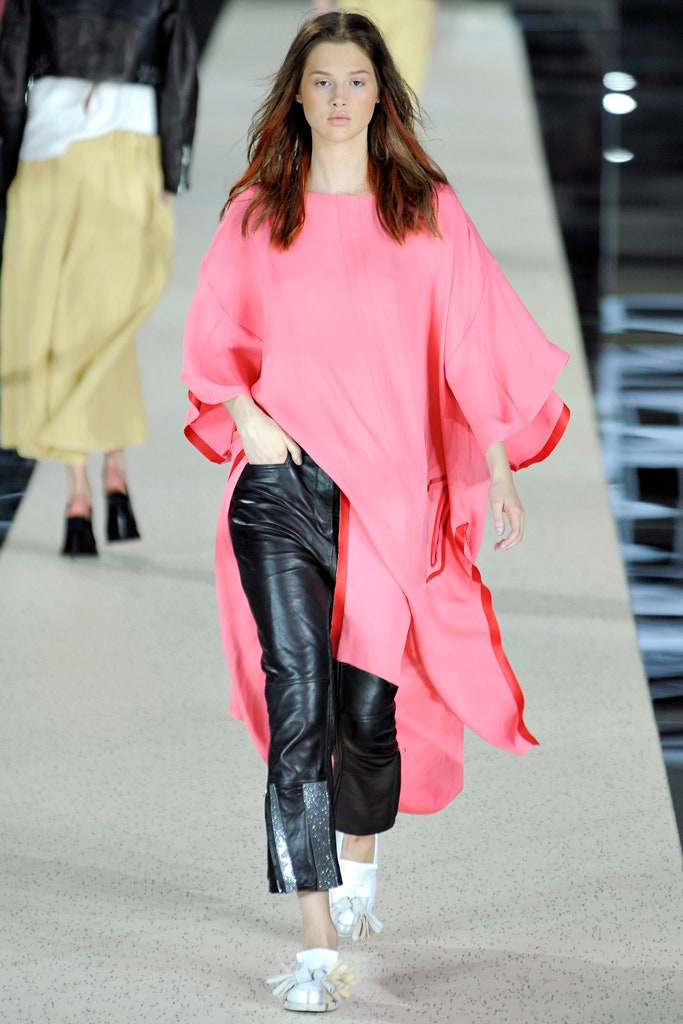 pink silk relaxed top with black leather pants