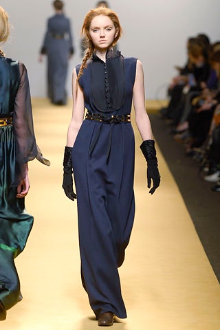 blue silk fitted jumpsuit with gloves