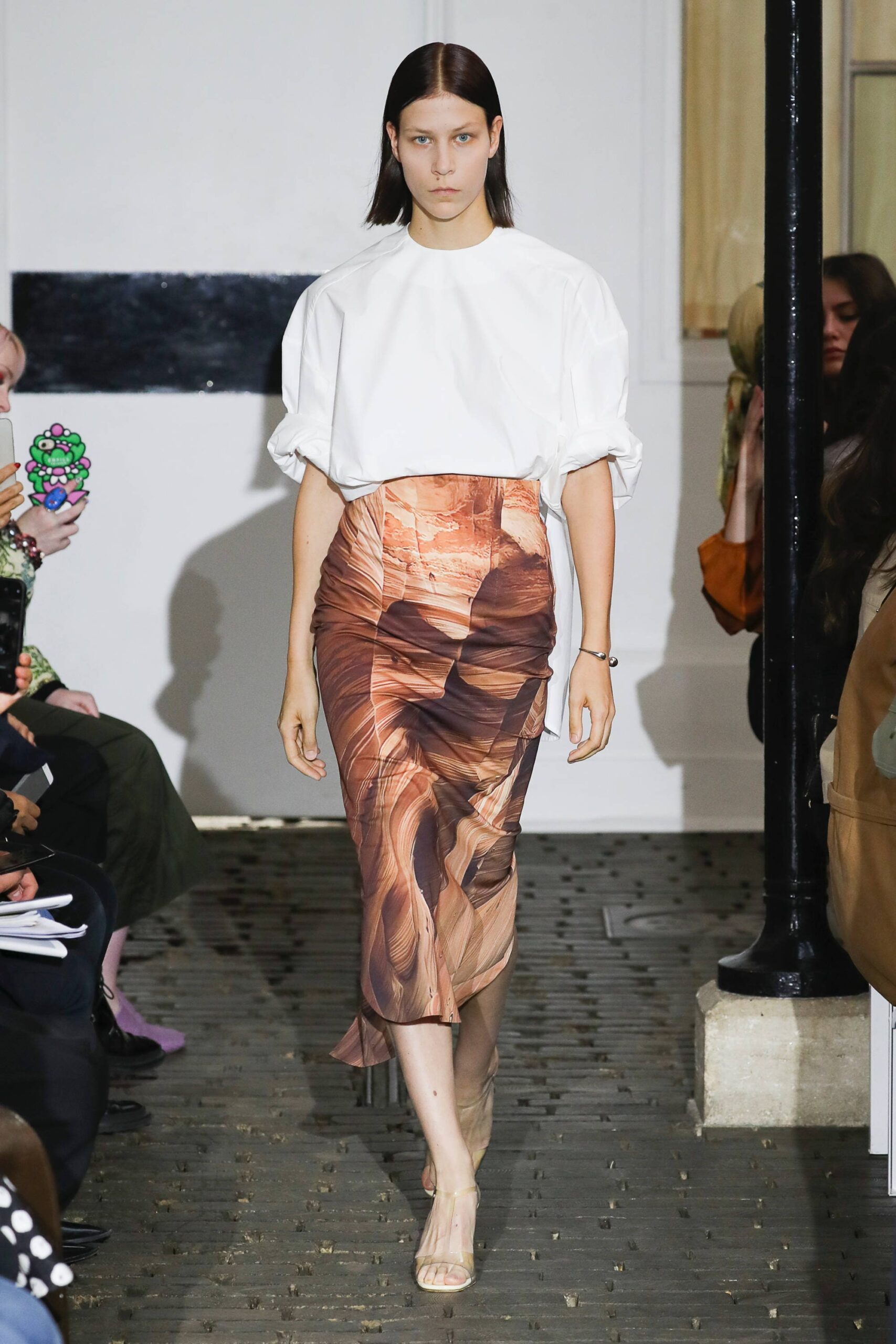 white relaxed top with brown draped skirt