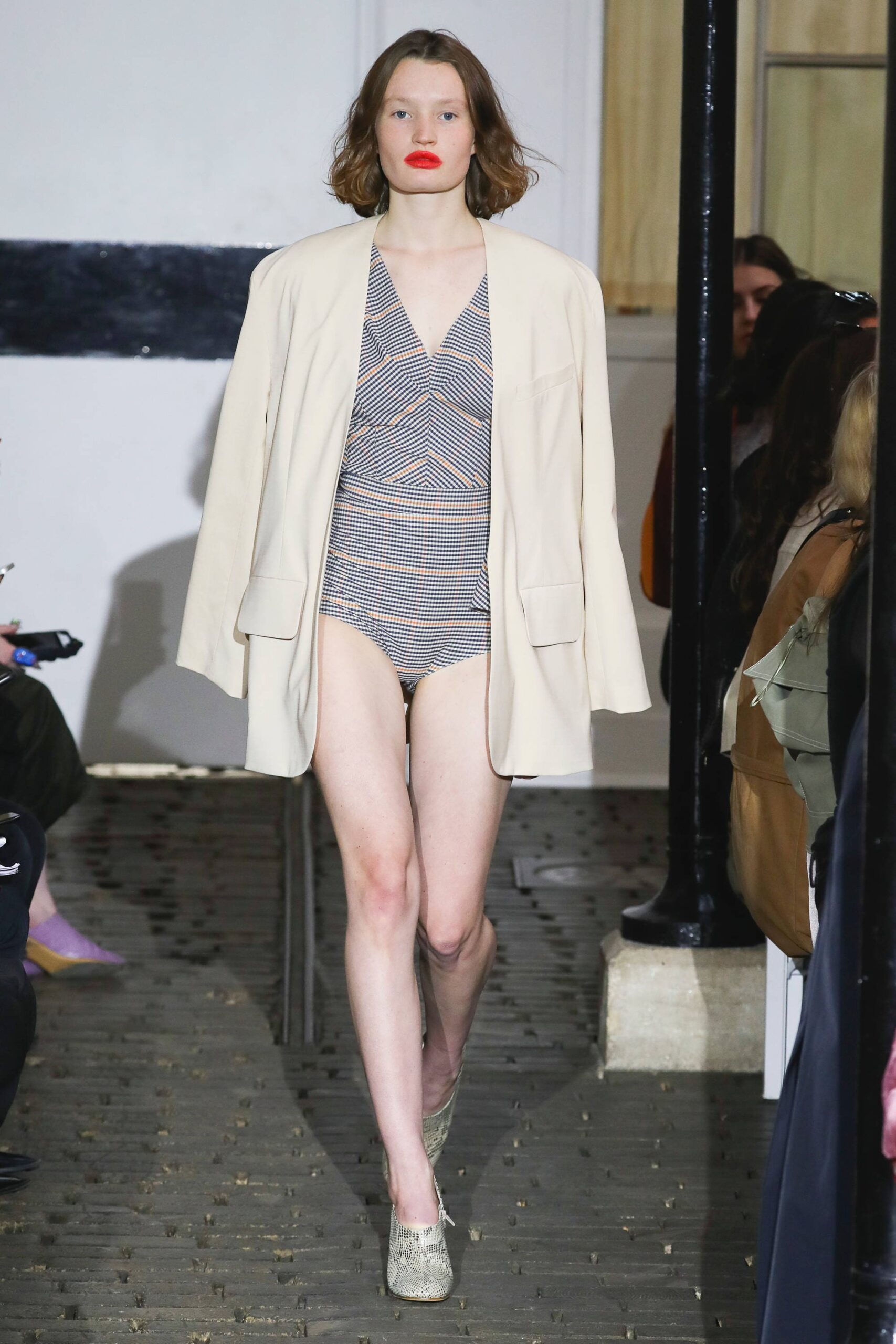 beige blazer and blue bodysuit