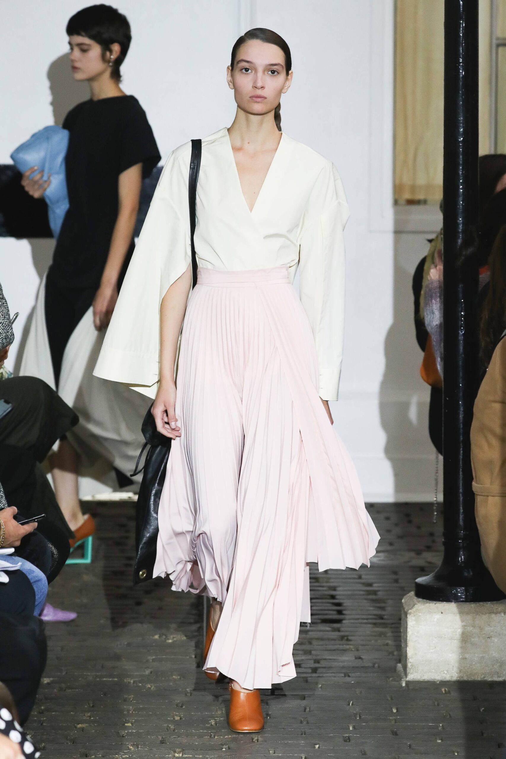 white blouse pink pleated skirt