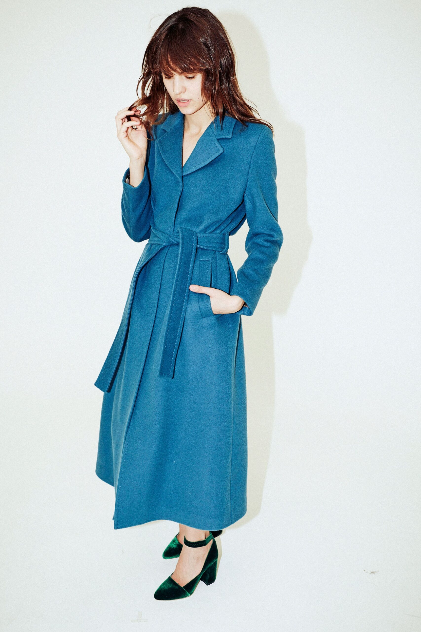 blue wool belted coat with green shoes