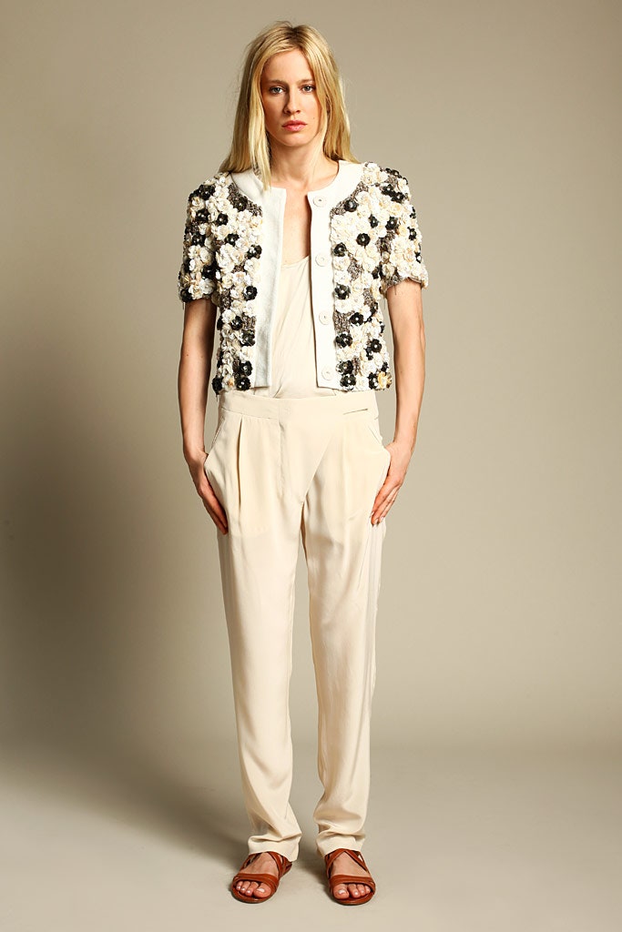 embroidered silk jacket and beige pants