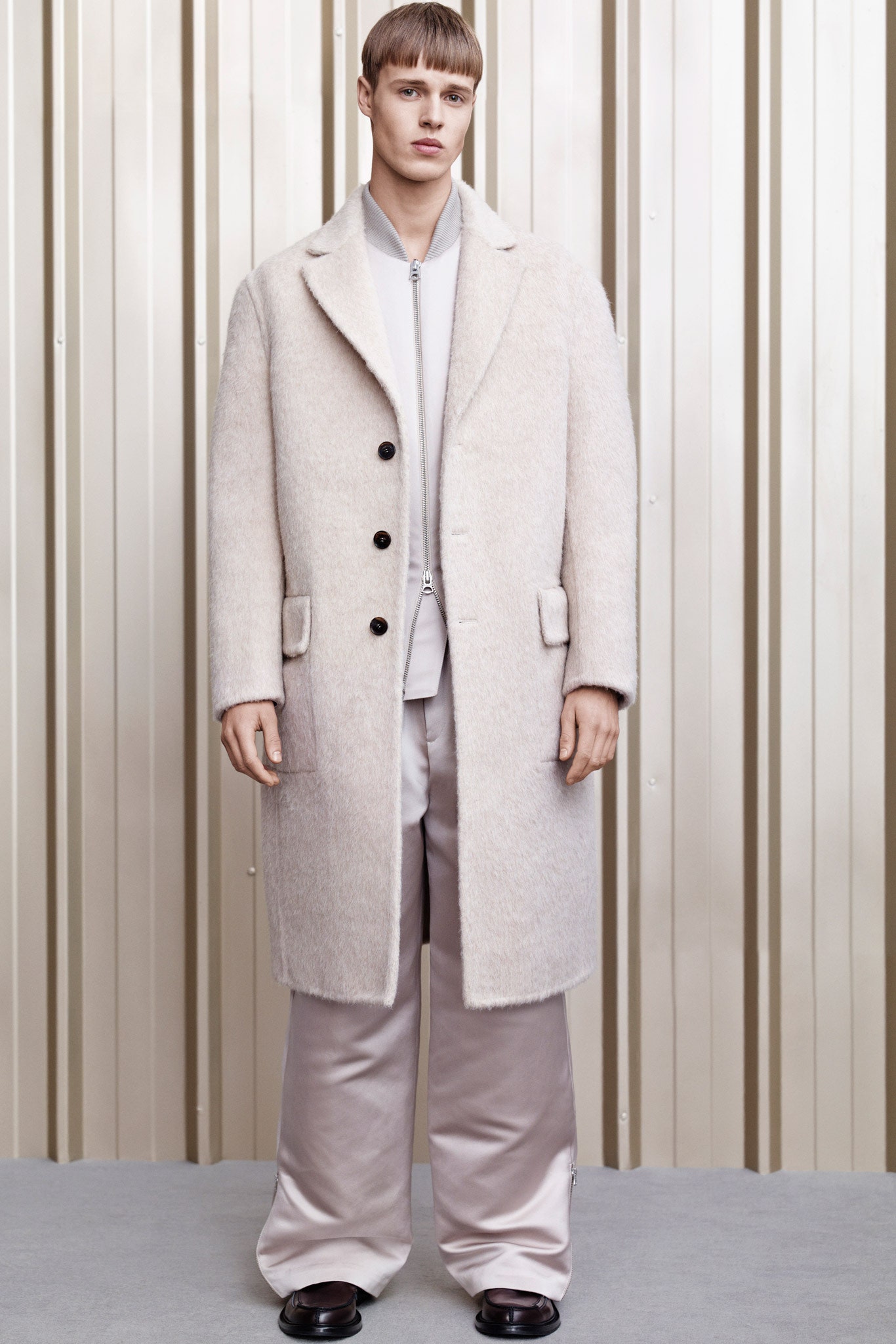 beige wool coat and gray silk pants