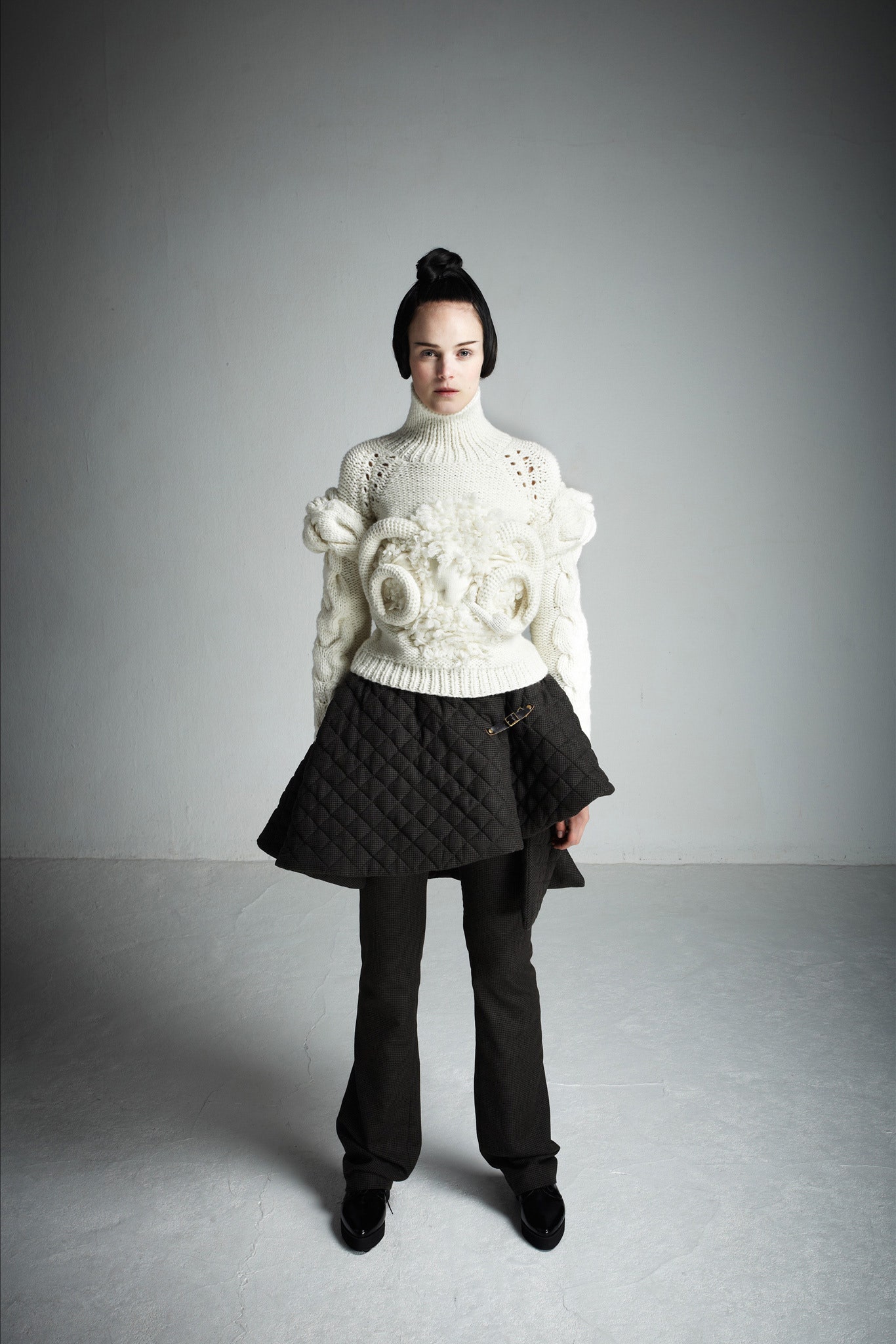white fitted sweater with black skirt