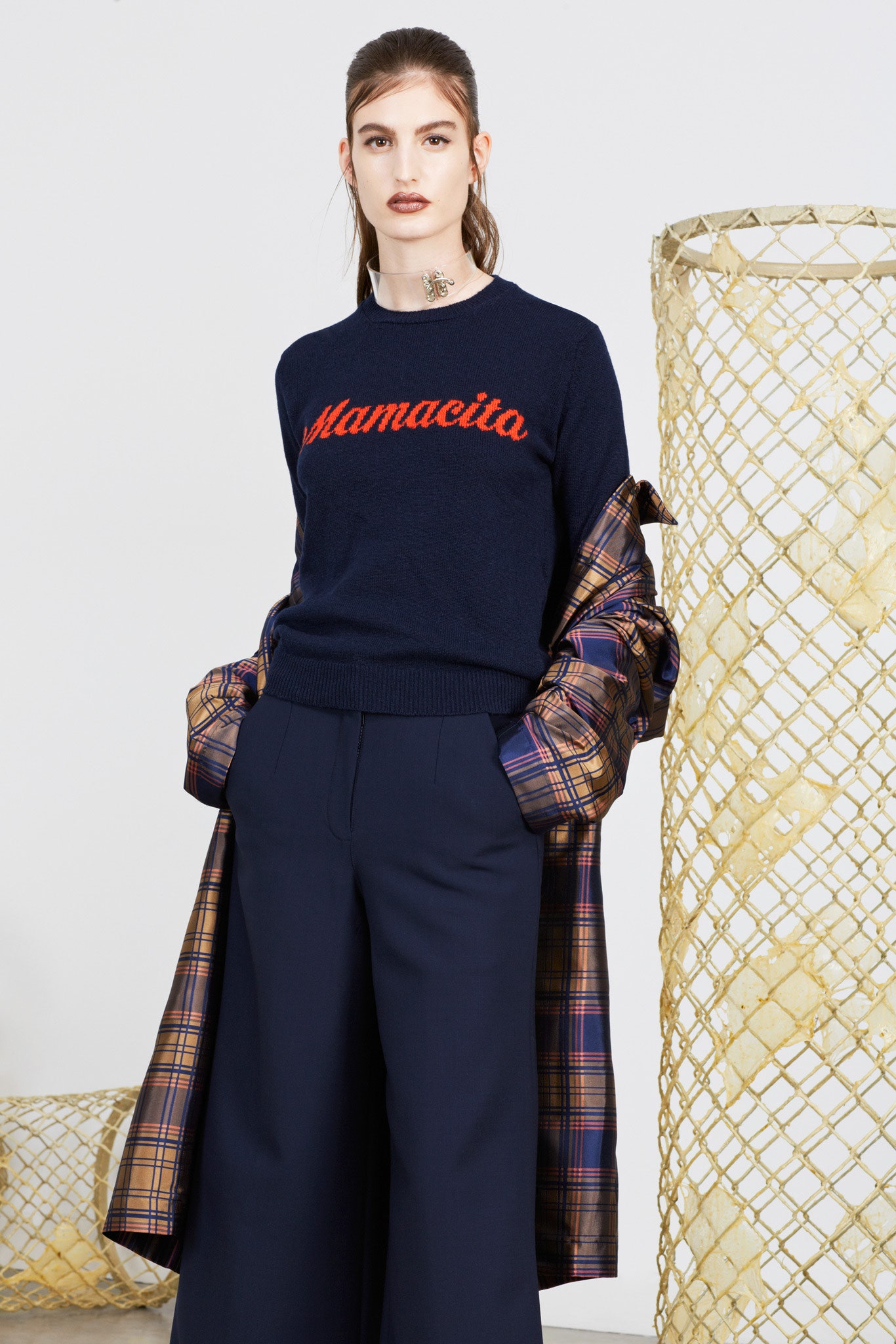 navy sweater with plaid coat