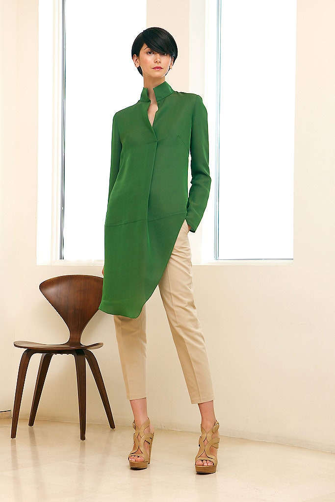 green silk shirt with beige tailored pants