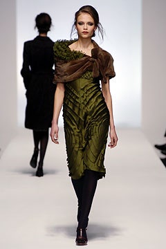 green pleated midi dress with brown wrap