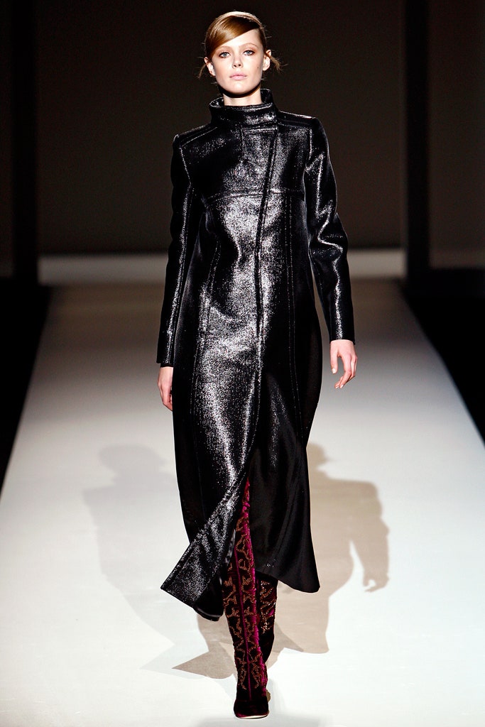 black vinyl fitted coat with red boots