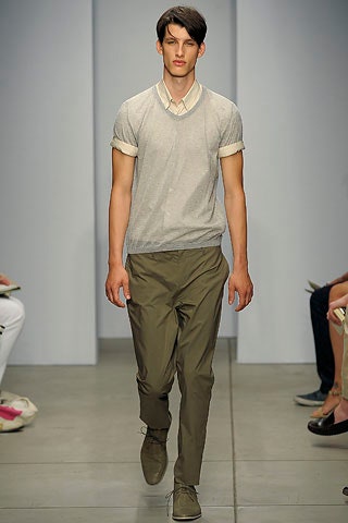 gray fitted sweater and green tailored pants