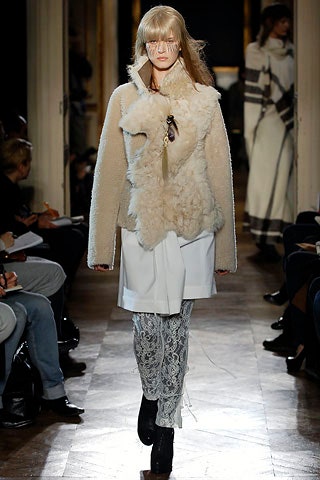 beige faux-fur jacket with white pants