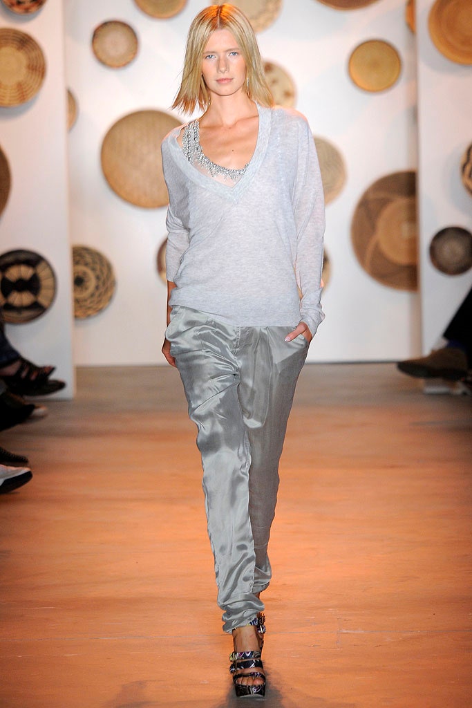 gray relaxed sweater and silver pants