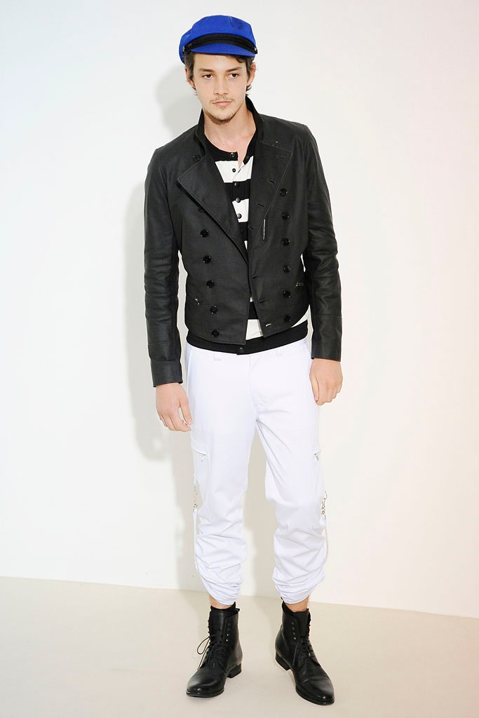 black leather jacket with white pants