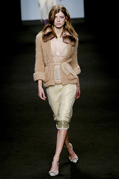 beige wool cardigan and gold midi skirt
