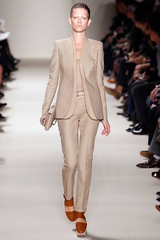beige tailored suit with clutch