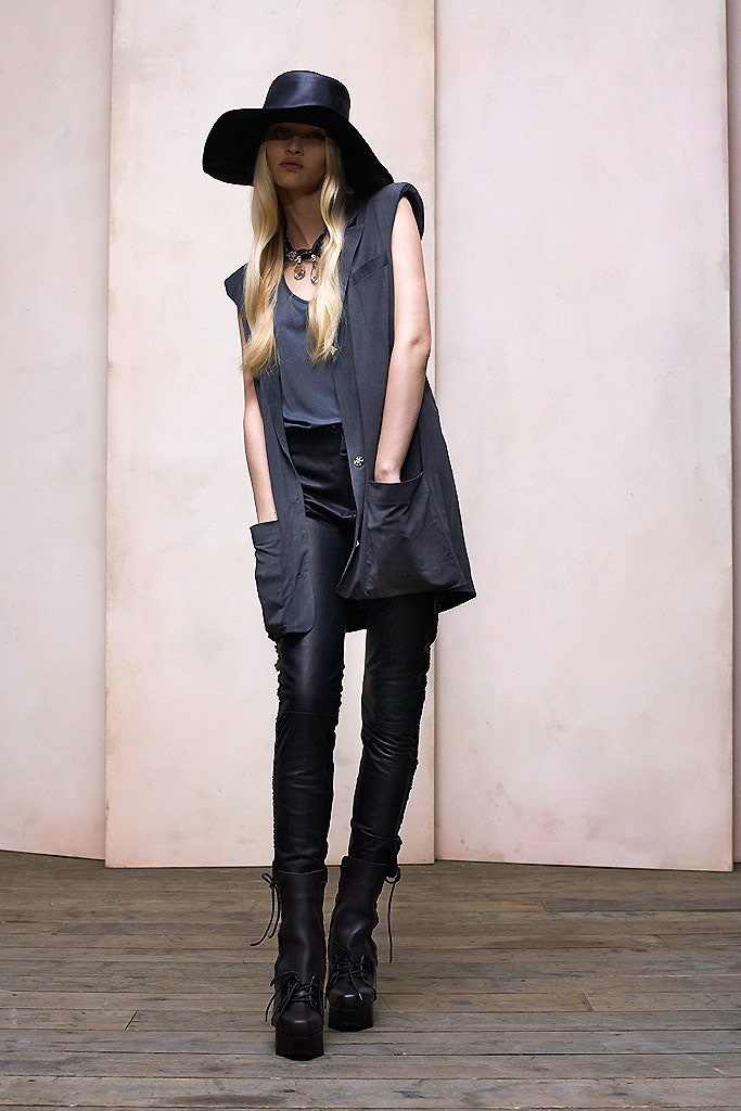 black relaxed vest with leather pants