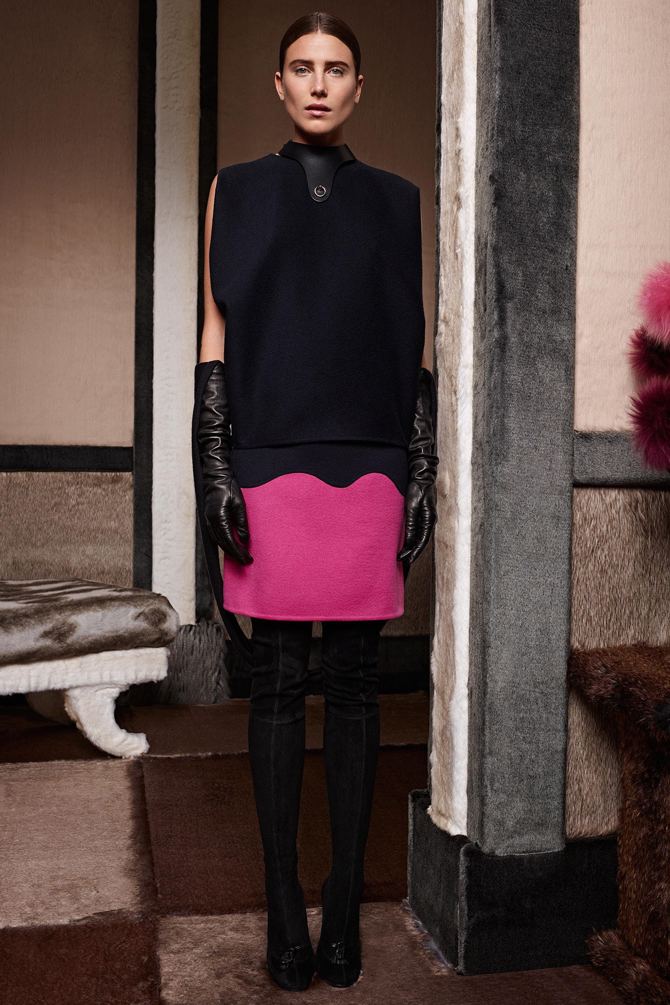 black wool sleeveless top with pink skirt