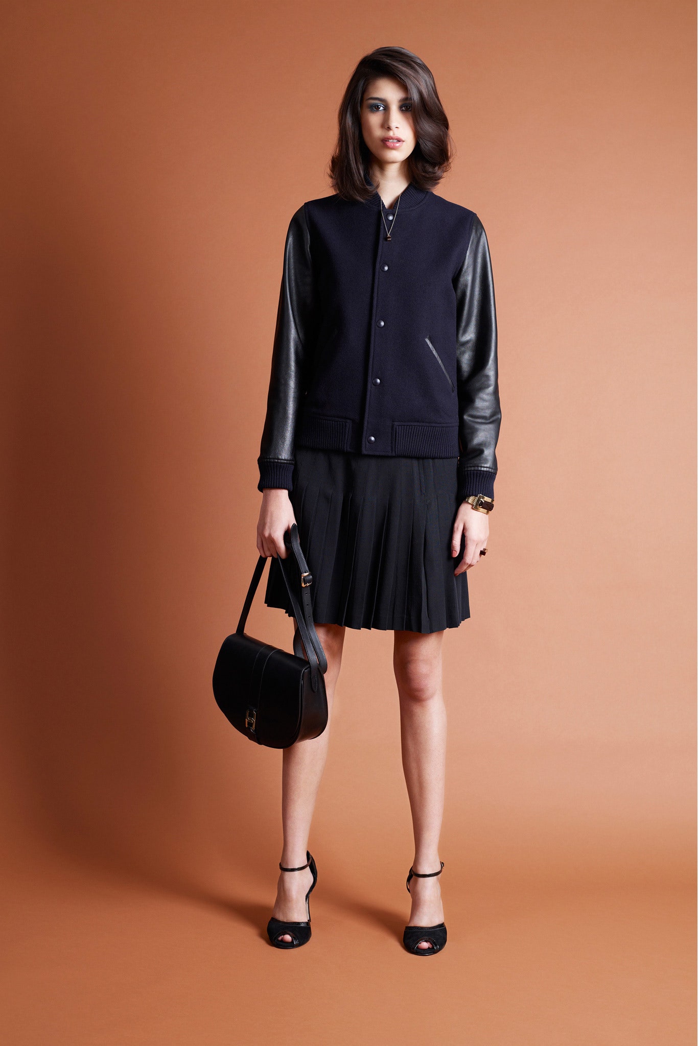 black jacket with pleated skirt