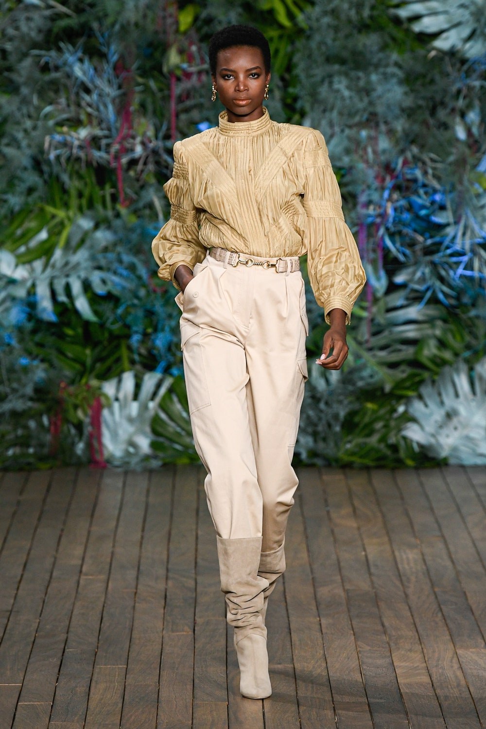 beige ruffled blouse with cream cargo pants