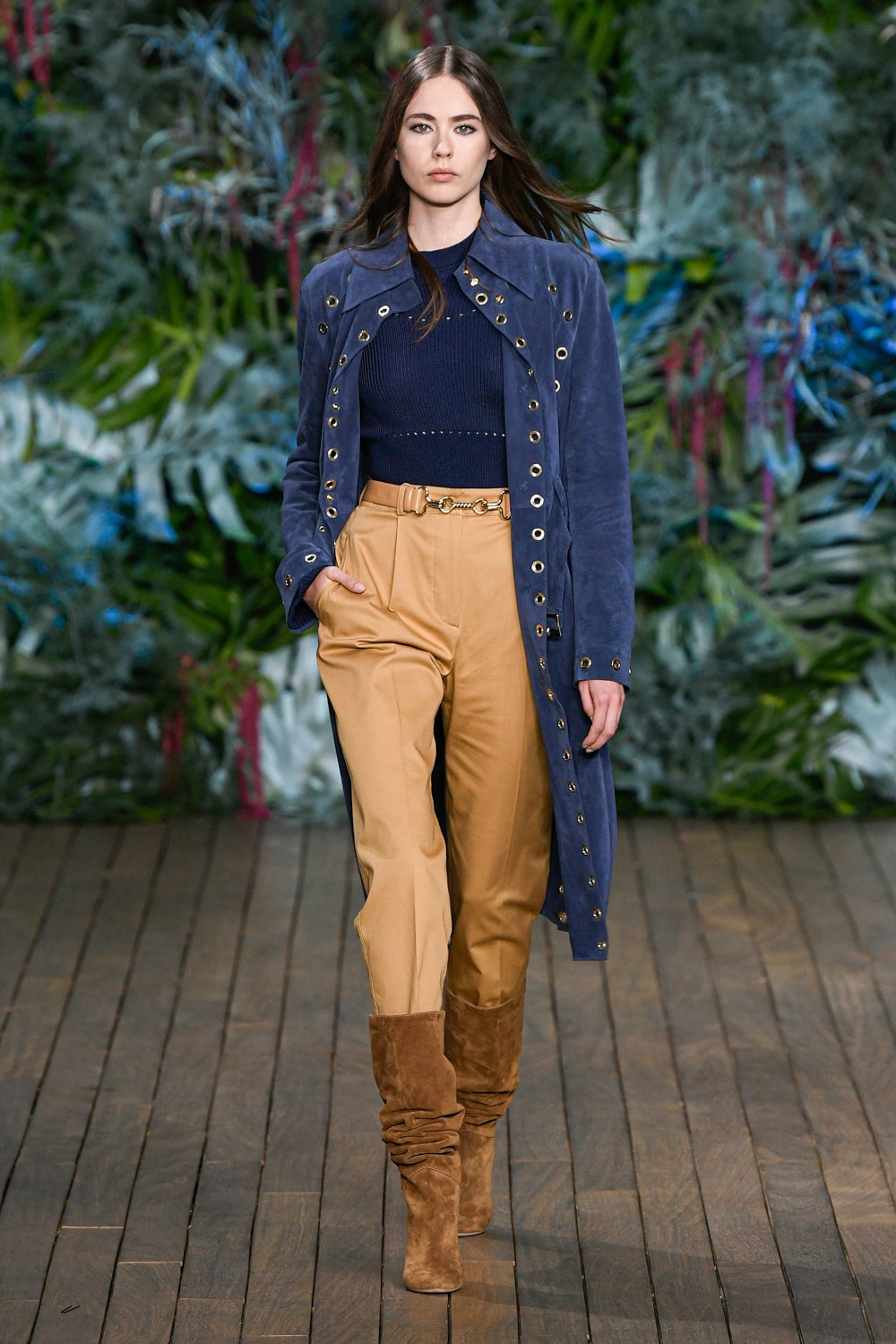 blue suede coat with beige pants