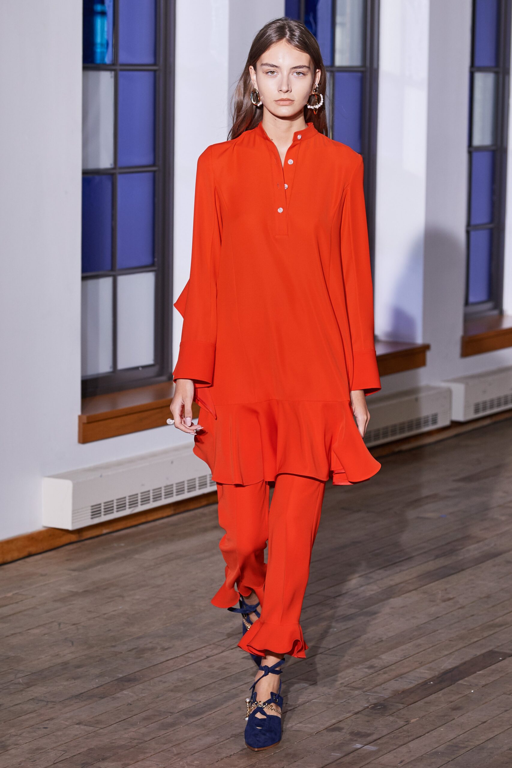 red long-sleeve collared fitted ruffled top
