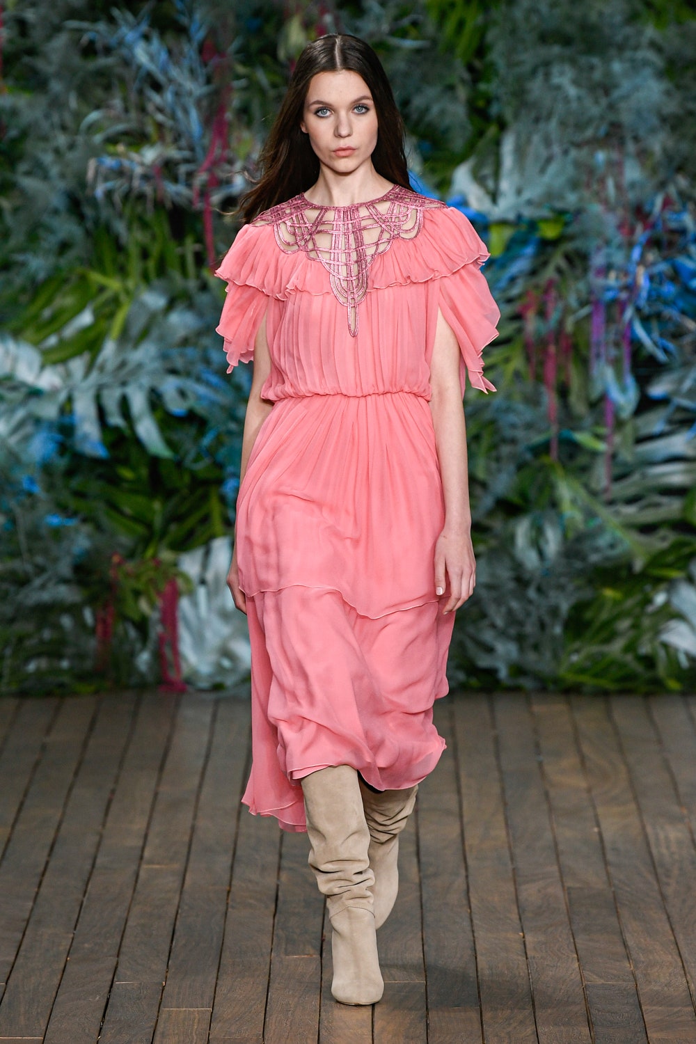 pink chiffon ruffled midi dress with beige boots