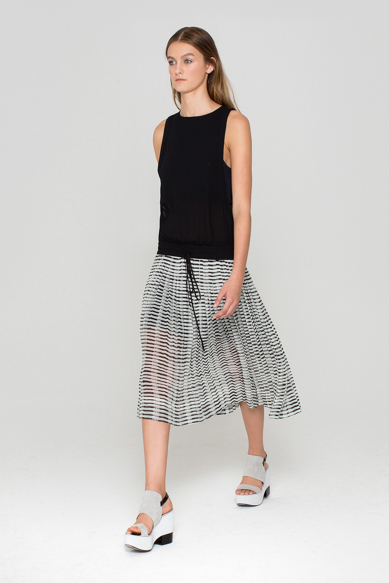 black sleeveless high-neck fitted top