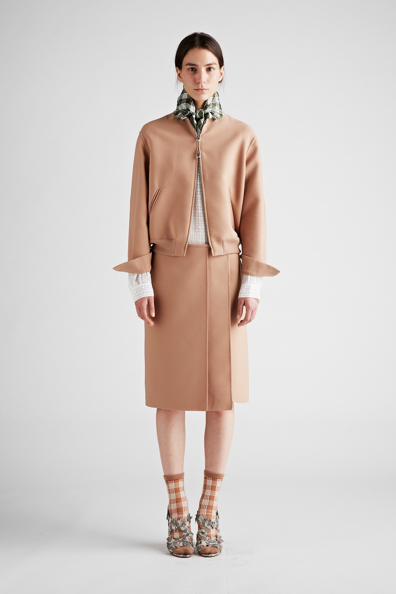 beige fitted jacket and skirt