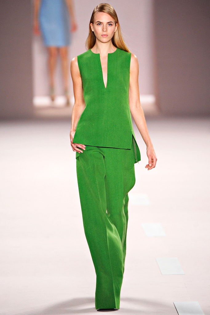 green fitted top and pants