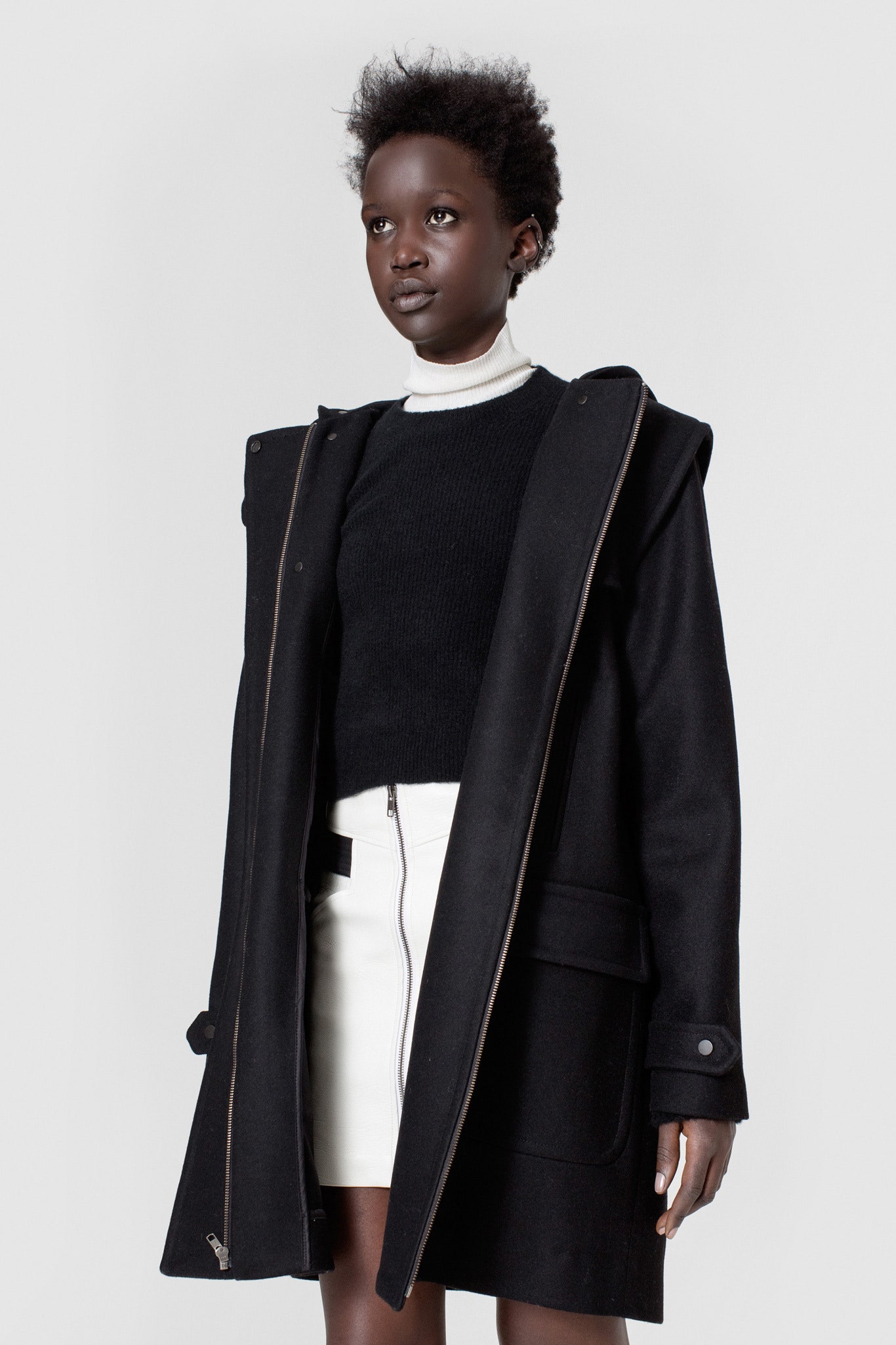 black wool coat with fitted sweater
