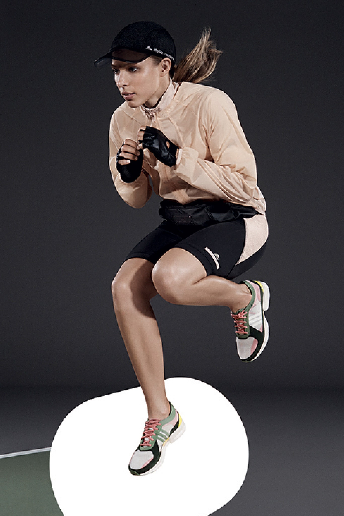 pink fitted jacket with black shorts
