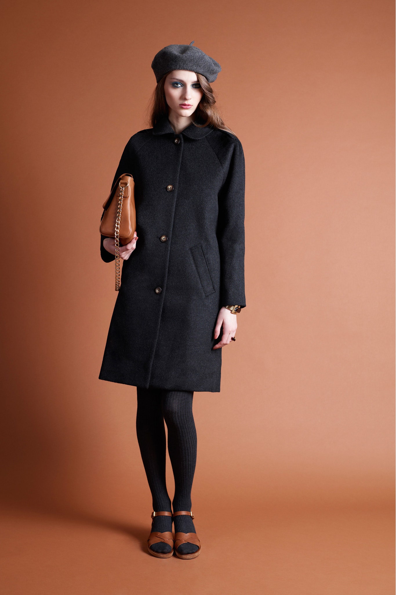 black wool long-sleeve collared fitted buttoned pockets coat