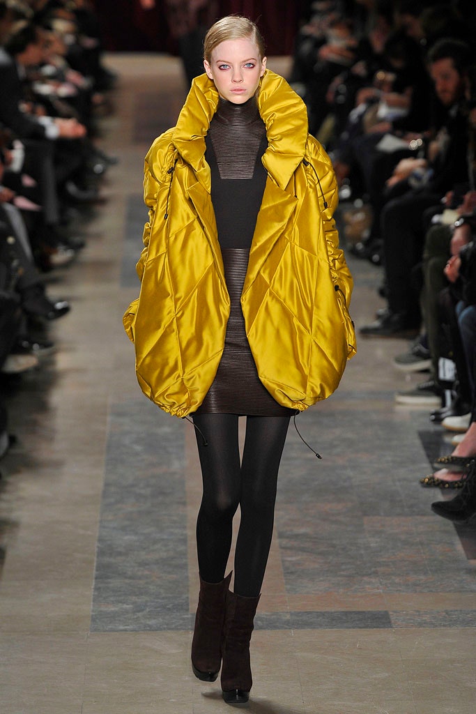 yellow padded coat with black dress