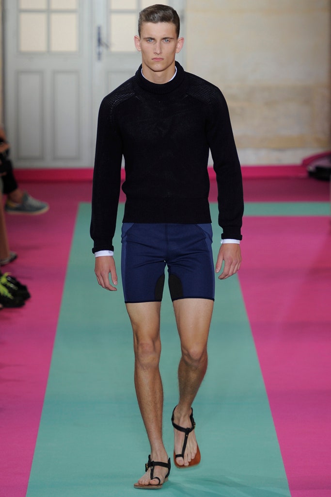 black fitted sweater with blue shorts