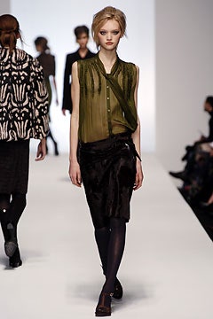 green silk fitted blouse and black pencil skirt