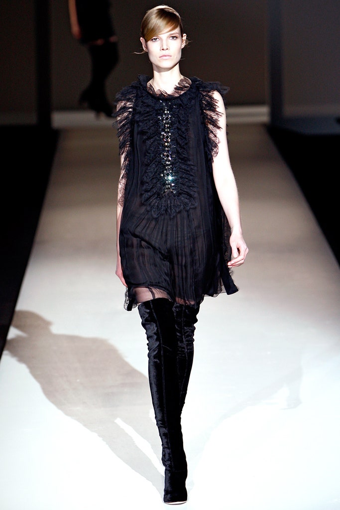 black silk ruffled mini dress with thigh-high boots