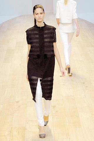 black relaxed top with white pants