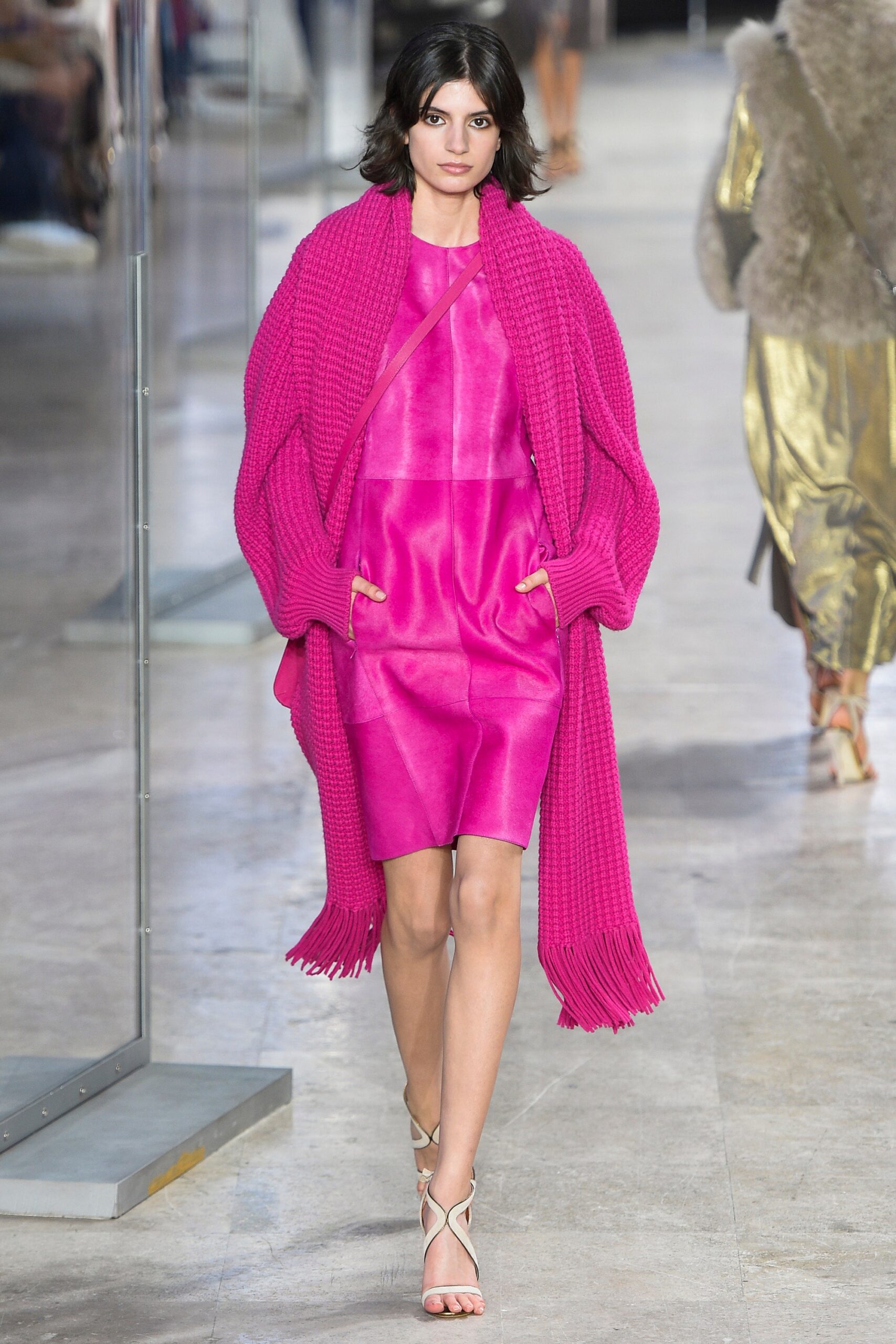 pink silk sleeveless dress with oversized knit coat