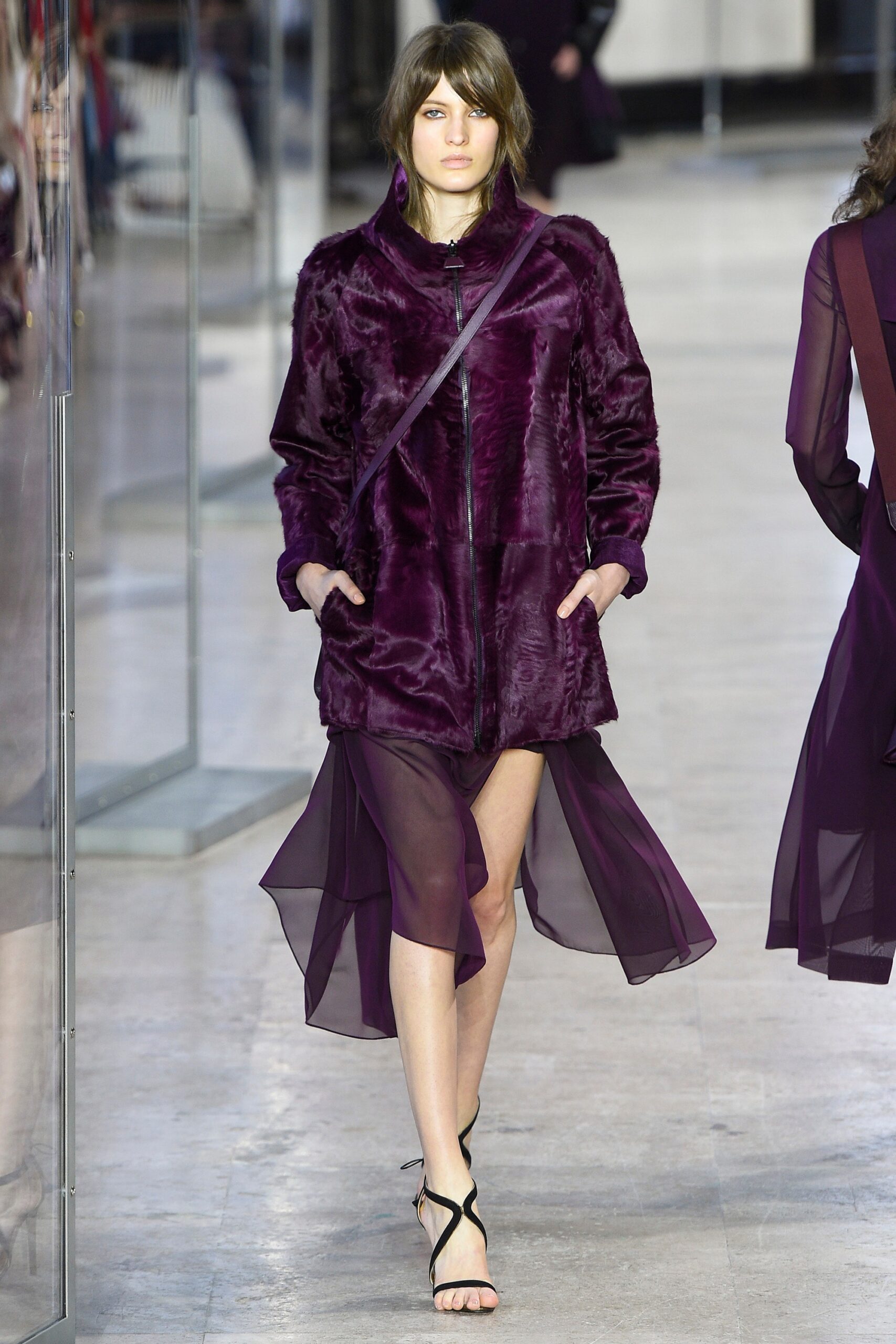 purple faux-fur coat and layered dress