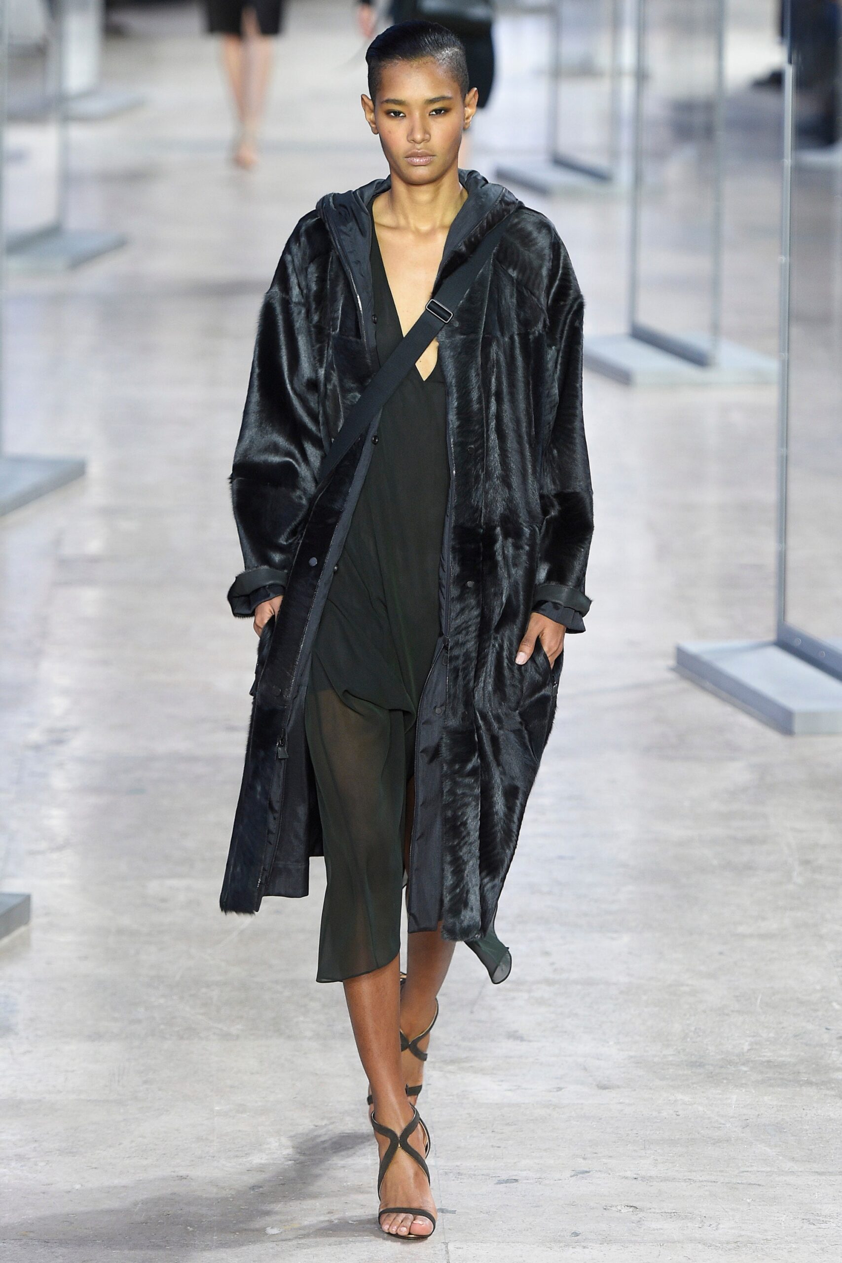 black faux-fur coat with layered dress