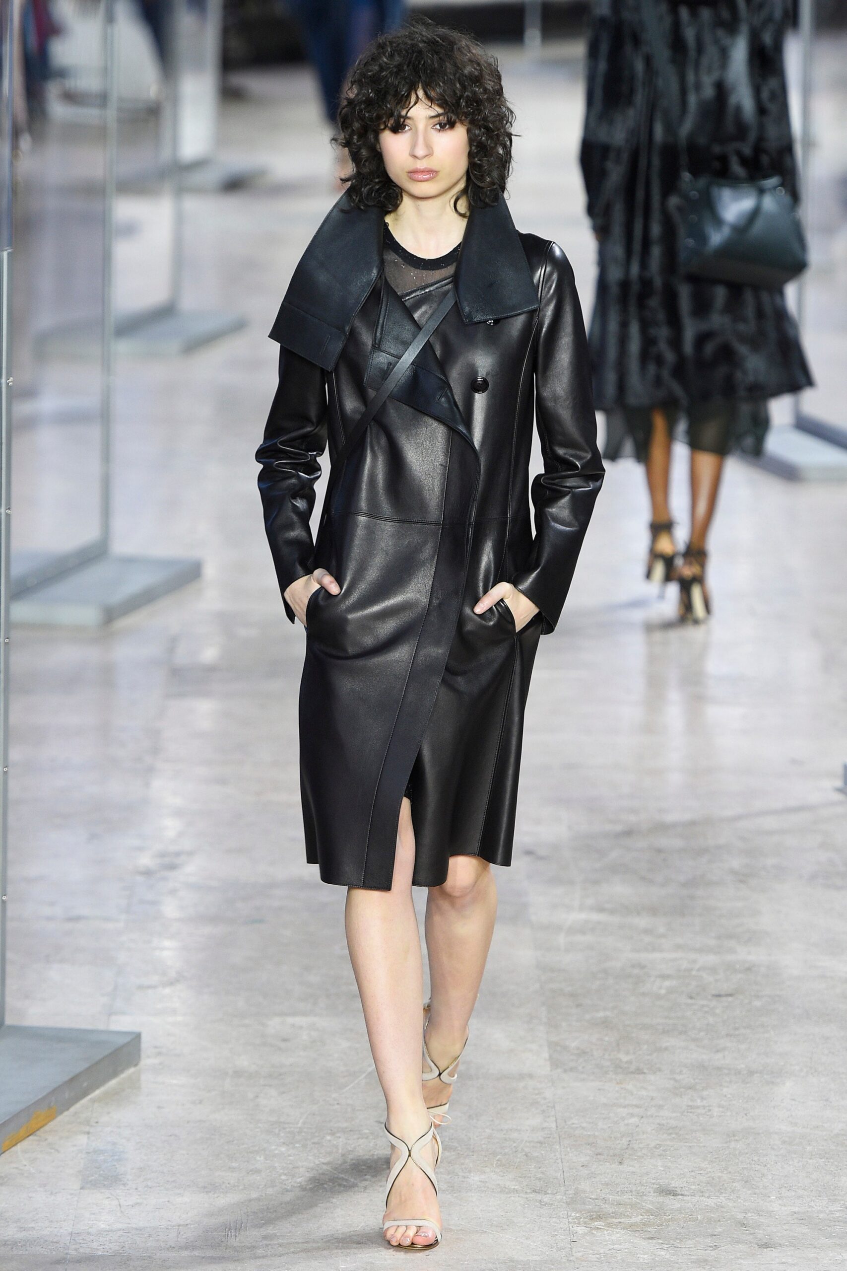 black leather sleeveless dress with strappy shoes