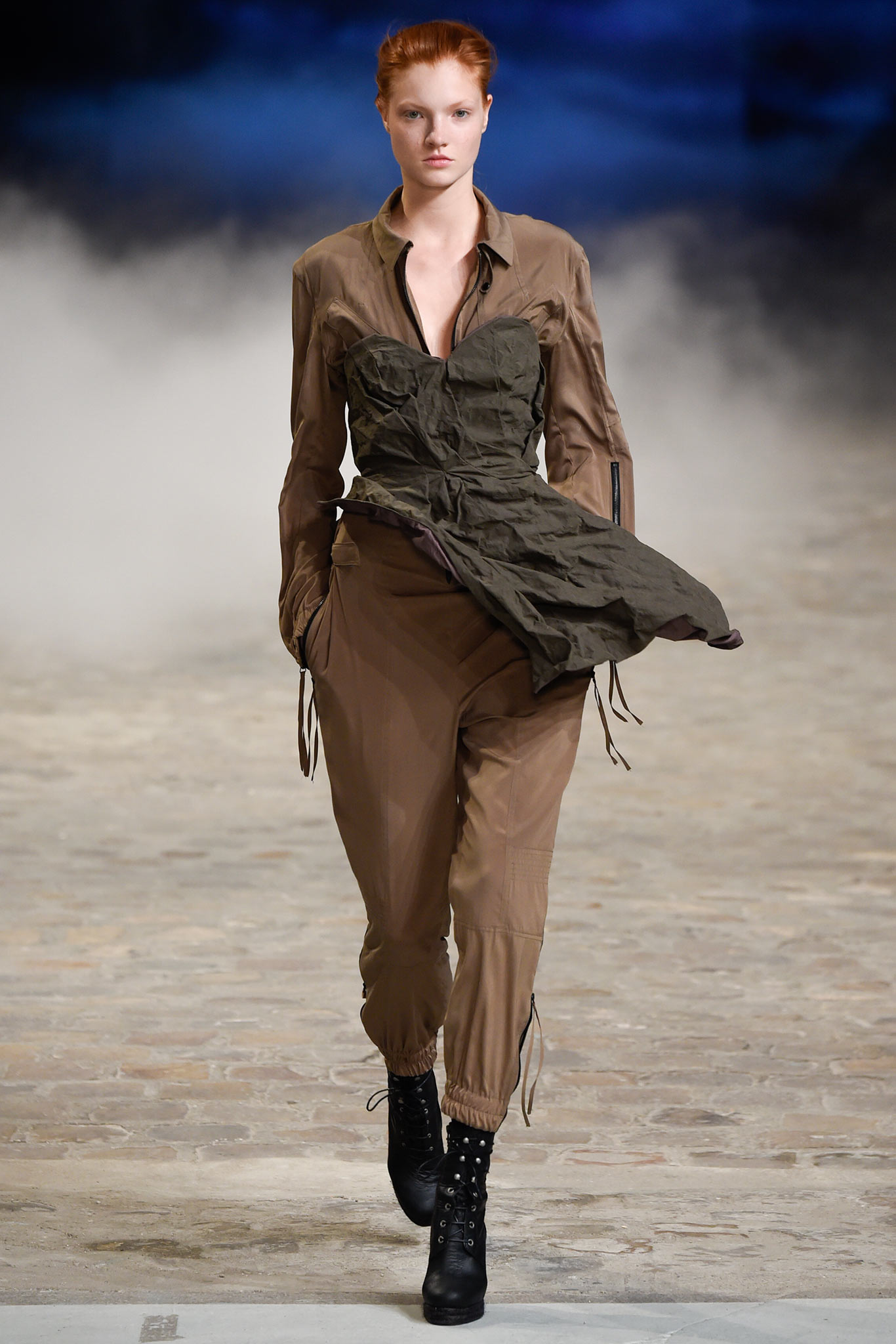 brown fitted jumpsuit with black boots