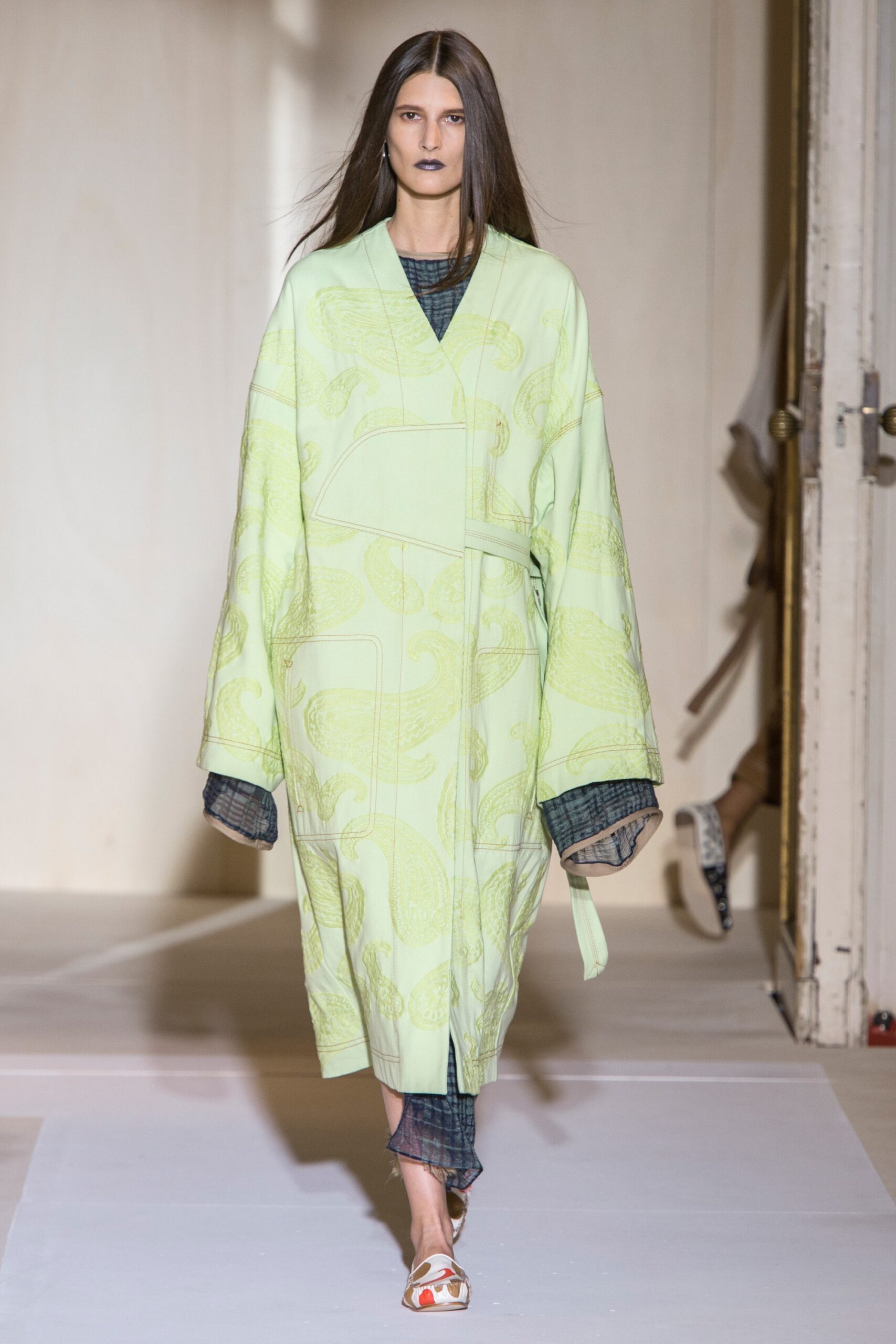 green embroidered coat with blue dress